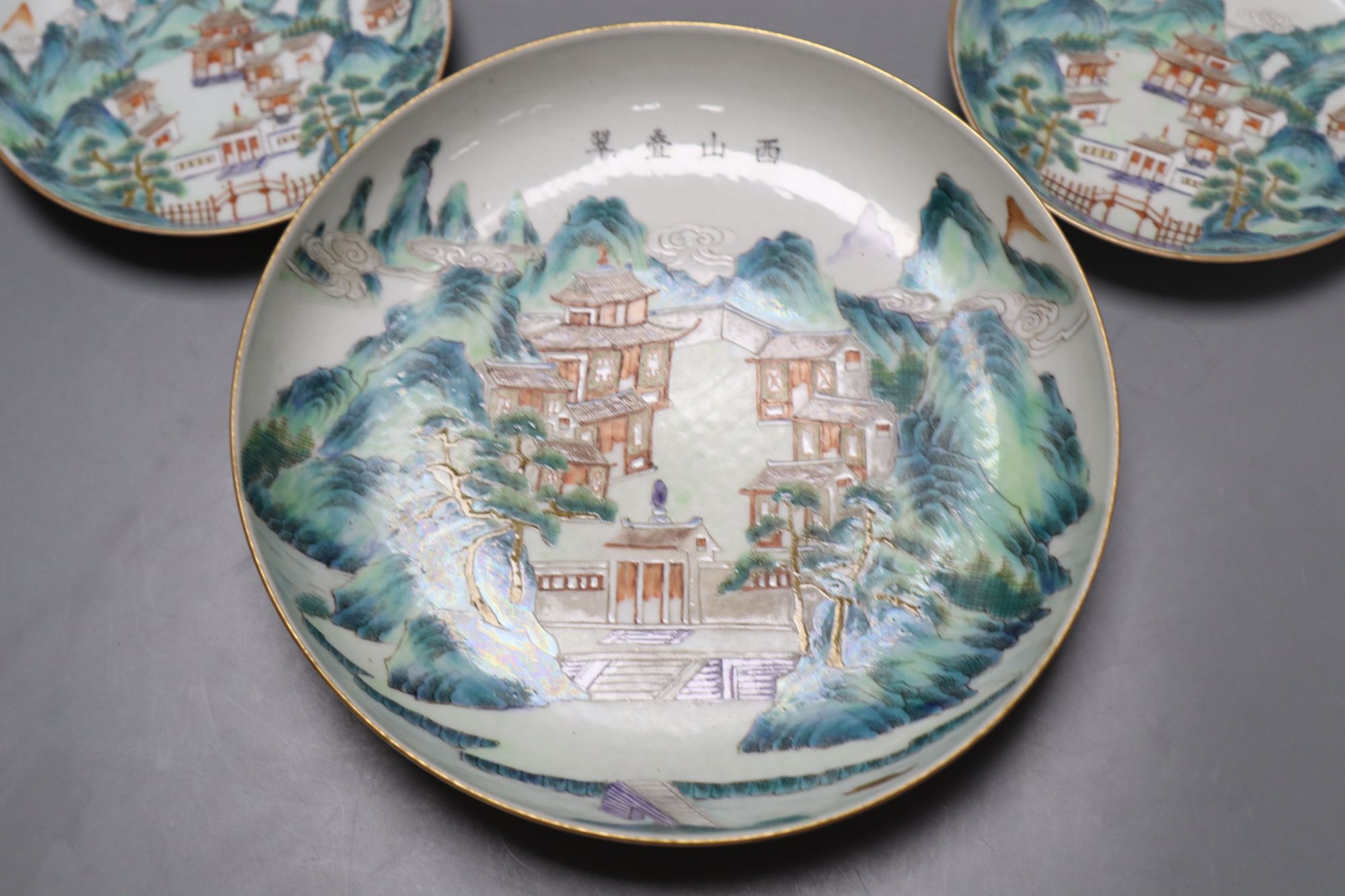 A pair of Chinese enamelled porcelain saucer dishes and two similar smaller bearing Daoguang marks, largest diameter 21cm